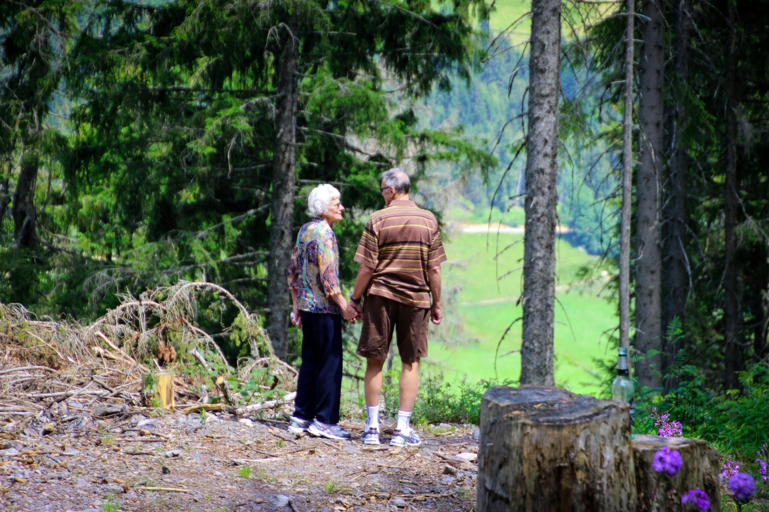Older couple in Des Moines discussing funeral planning and funeral insurance options together at home.